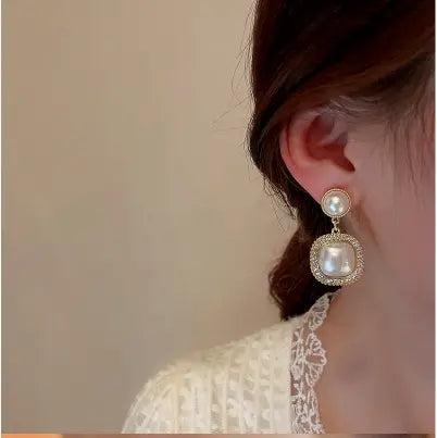 Sleek White with Rhinestone Earrings Try A Prompt